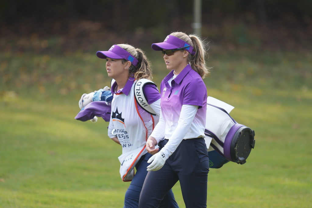 Brooke Henderson of World Team Brooke Henderson, right, of World Team walks with her caddie and sister Brittany Henderson on the first hole during the pool B match against Sweden team for the LPGA International Crown golf tournament at the New Korea Country Club in Goyang, South Korea, Saturday, Oct. 25, 2025. (AP Photo/Lee Jin-man)