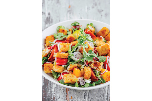 This image released by Harvest, an imprint of HarperCollins Publishers, shows a recipe for fish sticks on a rustic Italian salad called panzanella. (Eric Wolfinger/Harvest via AP) This image released by Harvest, an imprint of HarperCollins Publishers, shows a recipe for fish sticks on a rustic Italian salad called panzanella. (Eric Wolfinger/Harvest via AP)