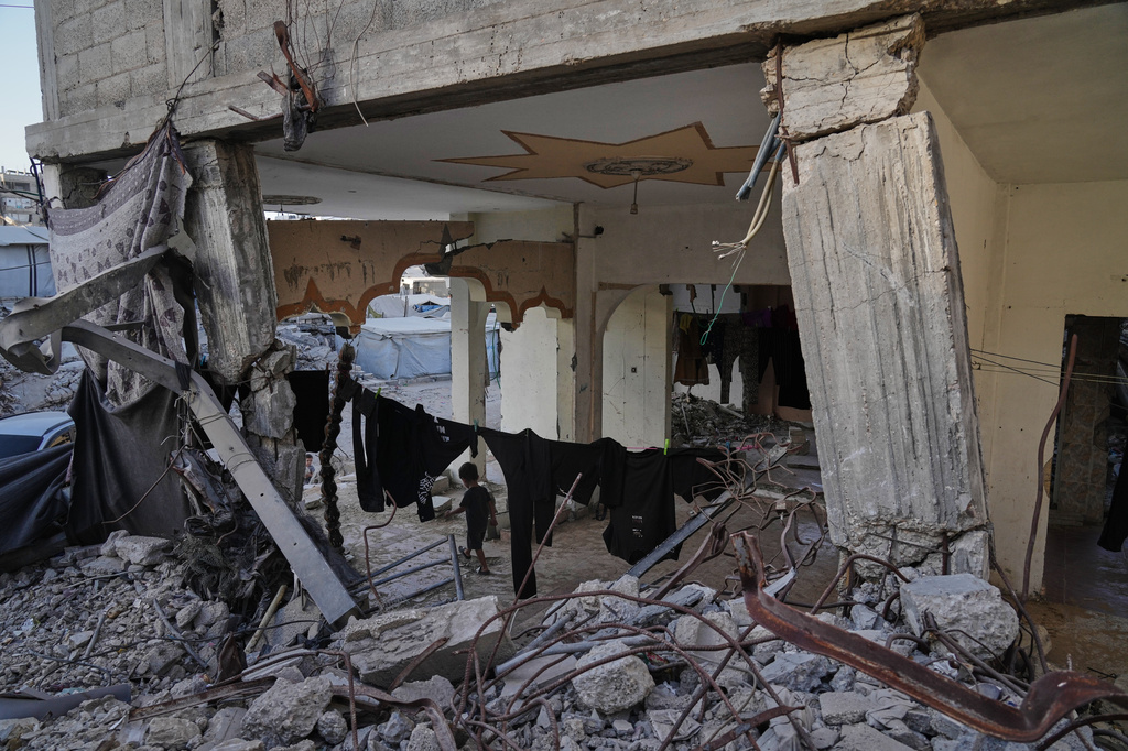 Displaced Palestinians shelter inside a building heavily damaged during the Israel-Hamas war in Gaza City, Thursday, Sept. 17, 2026. (AP Photo/Jehad Alshrafi)