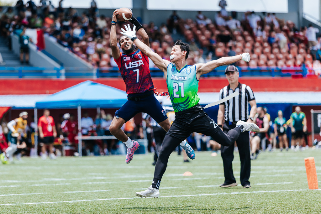 This photo provided by USA Football shows quarterback Darrell “Housh” Doucette III, left, in Panama in September 2025. (Lester Barnes/USA Football via AP)