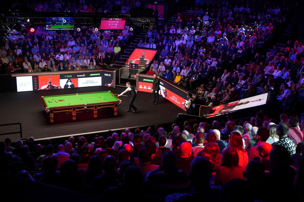 Spectators watch as England's Shaun Murphy plays a shot during his match against China's Wu Yize at the World Snooker Championship in Sheffield, England, Monday, May 4, 2026.(AP Photo/Ian Hodgson)