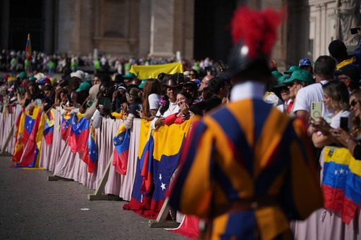 Faithful and pilgrims from Venezuela listen to Pope Leo XIV presiding over a Mass in St. Peter's Square at the Vatican, during which he canonized seven new saints of the Catholic Church, Sunday, Oct. 19, 2025. (AP Photo/Andrew Medichini) Faithful and pilgrims from Venezuela listen to Pope Leo XIV presiding over a Mass in St. Peter's Square at the Vatican, during which he canonized seven new saints of the Catholic Church, Sunday, Oct. 19, 2025. (AP Photo/Andrew Medichini)