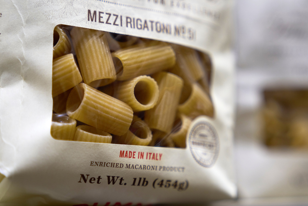Boxes of imported Italian pasta are seen on shelves, Tuesday, Nov. 11, 2025, in Detroit. (AP Photo/Ryan Sun)