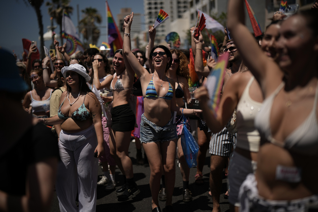 People take part in the annual Pride Parade along the beachfront of Tel Aviv, Israel, Friday, June 12, 2026. (AP Photo/Leo Correa)