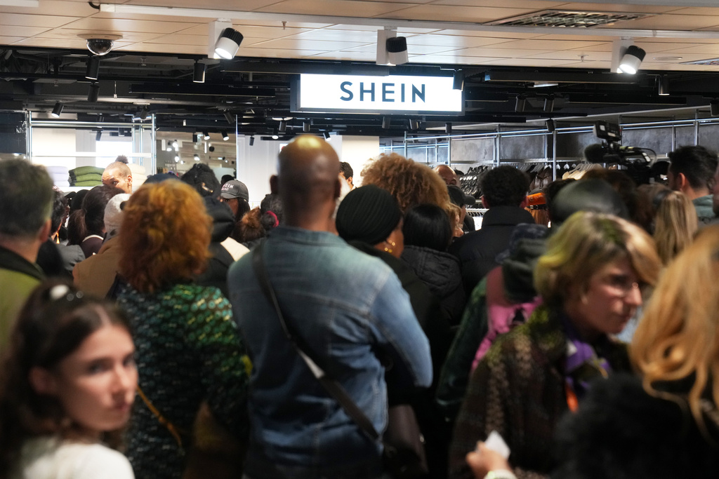 People visit the BHV department store as fast fashion powerhouse Shein opens its first permanent store, Wednesday, Nov. 5, 2025 in Paris. (AP Photo/Thibault Camus)