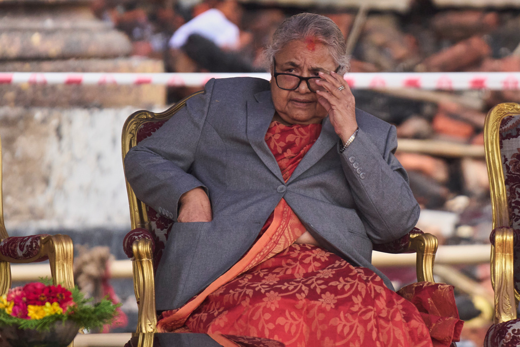 FILE - Nepal's new Prime Minister Sushila Karki waits as ministers prepare to take the oath of office administered by Nepali President Ram Chandra Poudel at the presidential building in Kathmandu, Nepal, on Sept. 15, 2025. (AP Photo/Niranjan Shrestha, File)