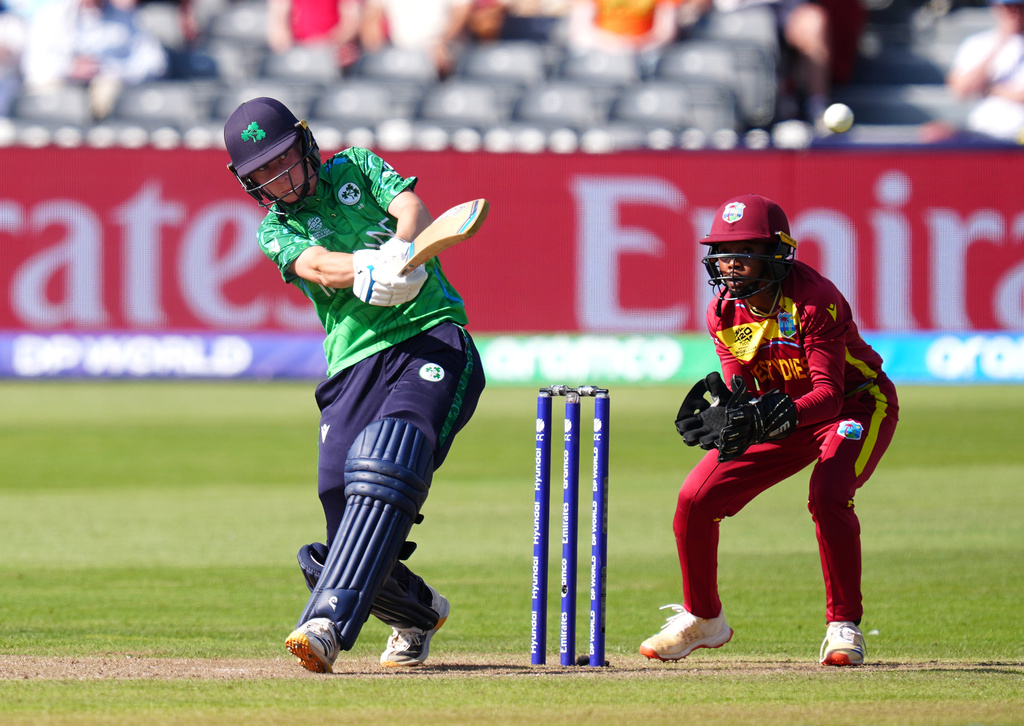 Ireland's Orla Prendergast, left, scores four runs to reach a half century during the Women's T20 World Cup cricket match between West Indies and Ireland, at Bristol County Ground, in Bristol, England, Saturday June 27, 2026. (David Davies/PA via AP)