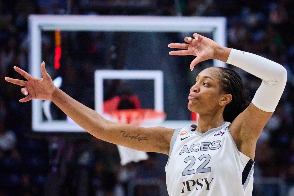 Las Vegas Aces' A'ja Wilson (22) reacts after scoring against the Toronto Tempo during the second half of a WNBA basketball game in Toronto, on Monday, July 20, 2026. (Sammy Kogan/The Canadian Press via AP)