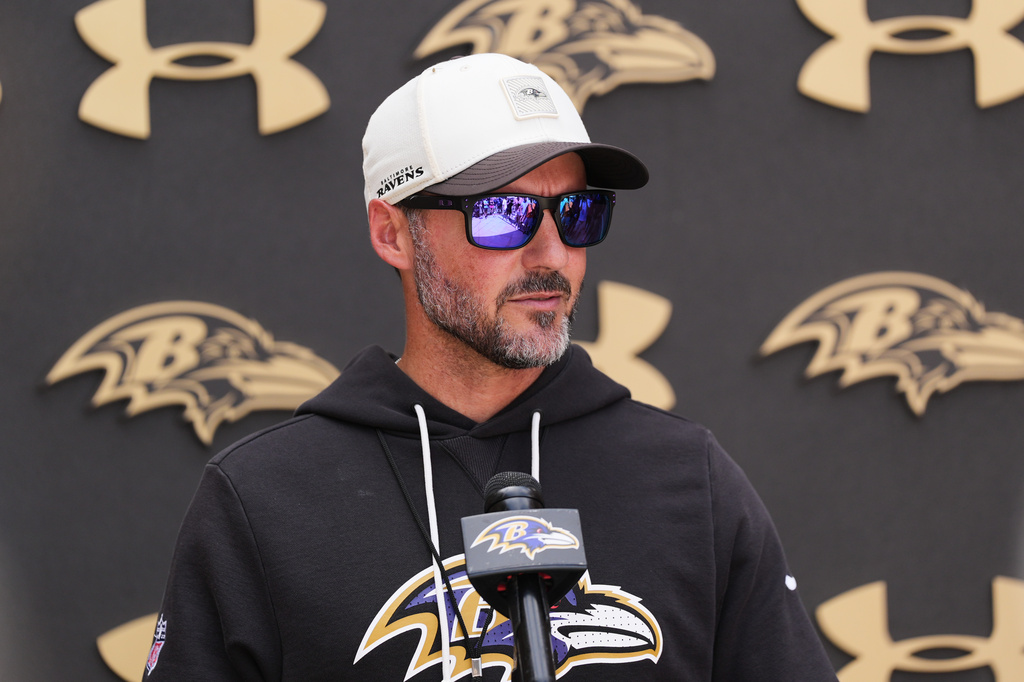 Baltimore Ravens head coach Jesse Minter speaks during a press conference following the team's NFL football joint training camp with the Washington Commanders, Wednesday, Aug. 26, 2026, in Owings Mills, Md. (AP Photo/Stephanie Scarbrough)