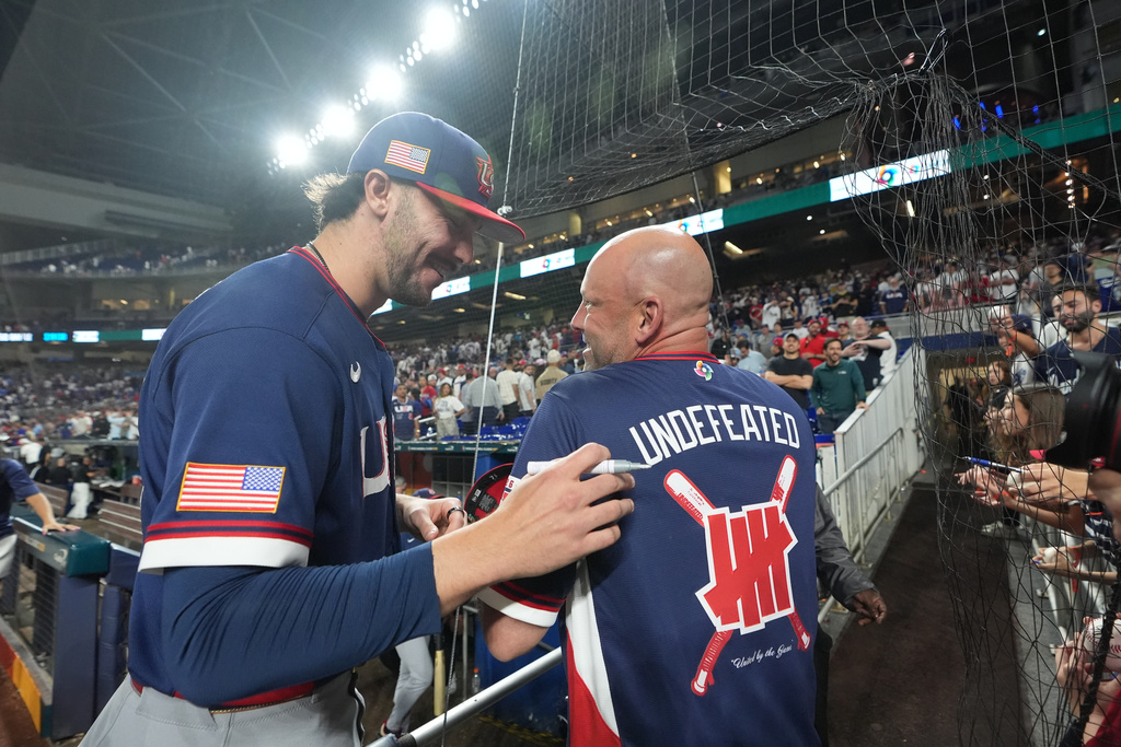 United States pitcher Paul Skenes signs autographs after the team defeated the Dominican Republic at a World Baseball Classic semifinal game, Sunday, March 15, 2026, in Miami. (AP Photo/Lynne Sladky)