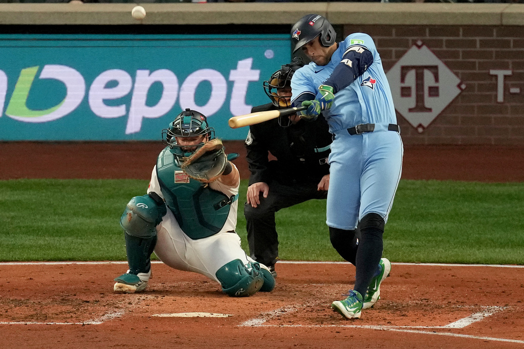 Toronto Blue Jays' George Springer connects for a solo home run against the Seattle Mariners during the fourth inning in Game 3 of baseball's American League Championship Series, Wednesday, Oct. 15, 2025, in Seattle. (AP Photo/Abbie Parr)
