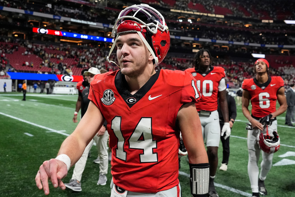 Georgia quarterback Gunner Stockton (14) walks off the field after an NCAA college football game against Georgia Tech, Friday, Nov. 28, 2025, in Atlanta. (AP Photo/Mike Stewart)
