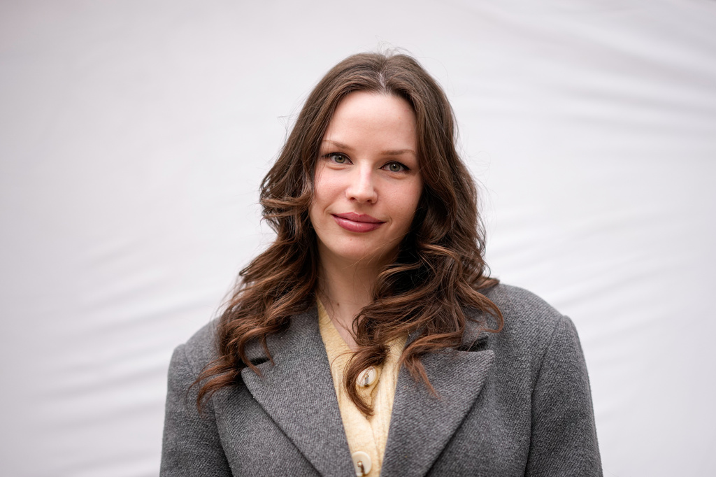 Dori Szaday, 22, poses for a portrait in Budapest, Hungary, Monday, April 13, 2026. "There's a belief that Hungarians are willing to put up with anything. We finally proved that wrong." (AP Photo/Petr David Josek)