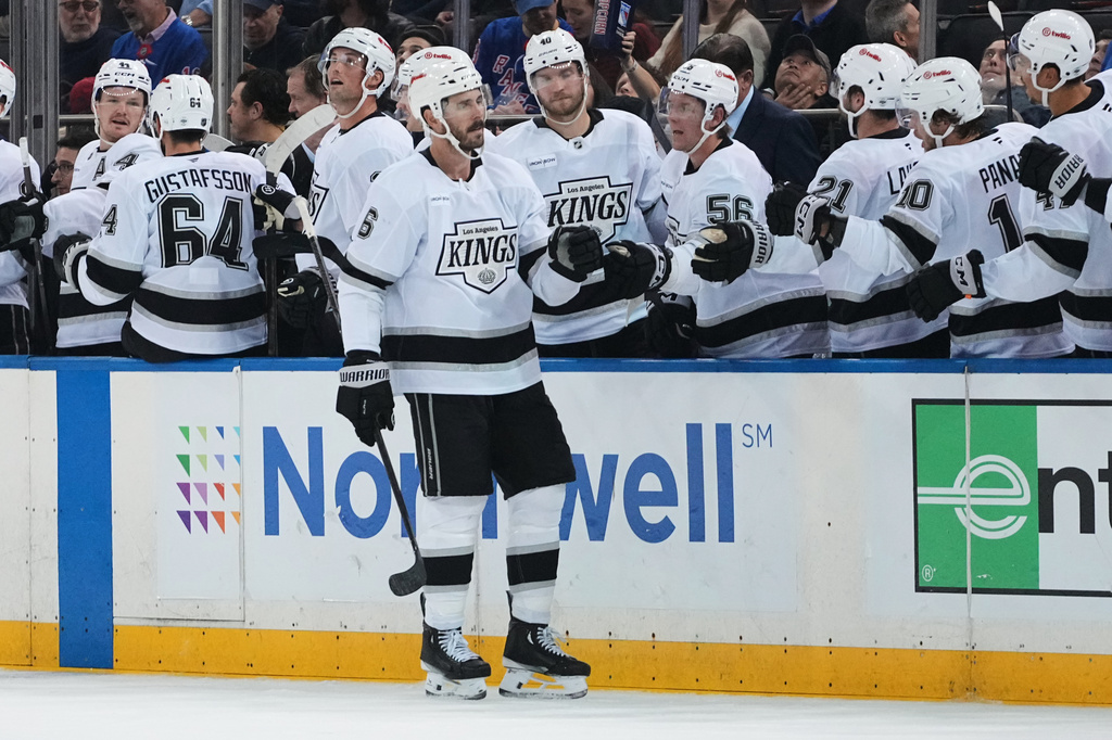 Los Angeles Kings' Joel Edmundson (6) celebrates with teammates after scoring a goal during the third period of an NHL hockey game against the New York Rangers Monday, Oct. 26, 2026, in New York. (AP Photo/Frank Franklin II)