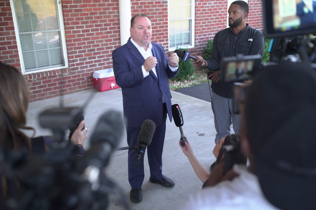 Tim Farris, Hurricane Chapel senior pastor, speaks to the press after a vigil at his church in McEwen, Tenn., on Saturday, Oct. 11, 2025, for victims of a blast that leveled an explosives plant. (AP Photo/Obed Lamy)