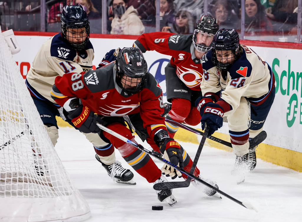 Ottawa Charge's Ronja Savolainen (88) defends against Montreal Victoire's Catherine Dubois (28) during first period PWHL hockey game action in Winnipeg, Canada, Sunday, March 22, 2026. (John Woods/The Canadian Press via AP)