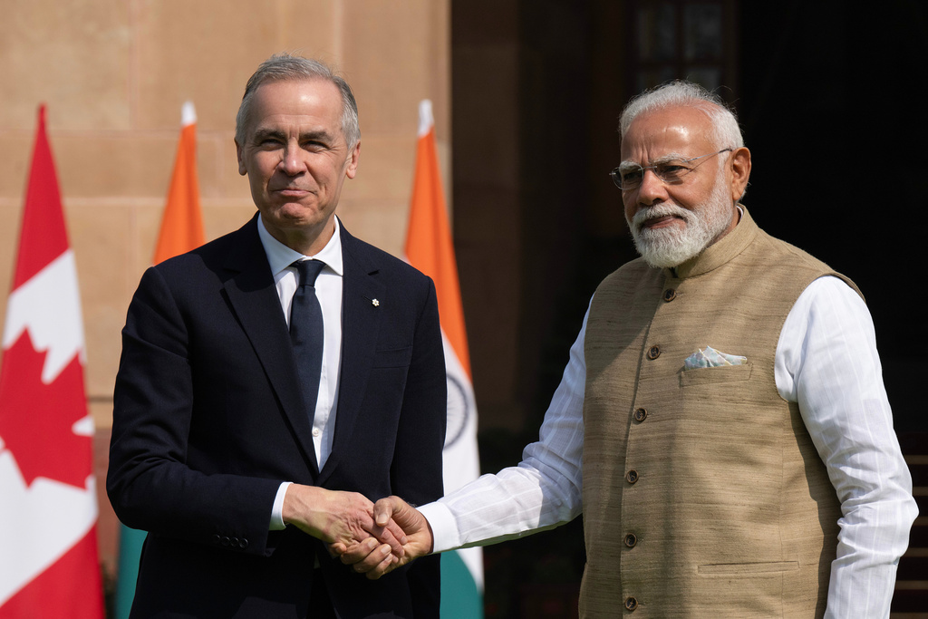 Canada's Prime Minister Mark Carney, left, meets Indian Prime Minister Narendra Modi at Hyderabad House in New Delhi, Monday, March 2, 2026. (Adrian Wyld/The Canadian Press via AP)