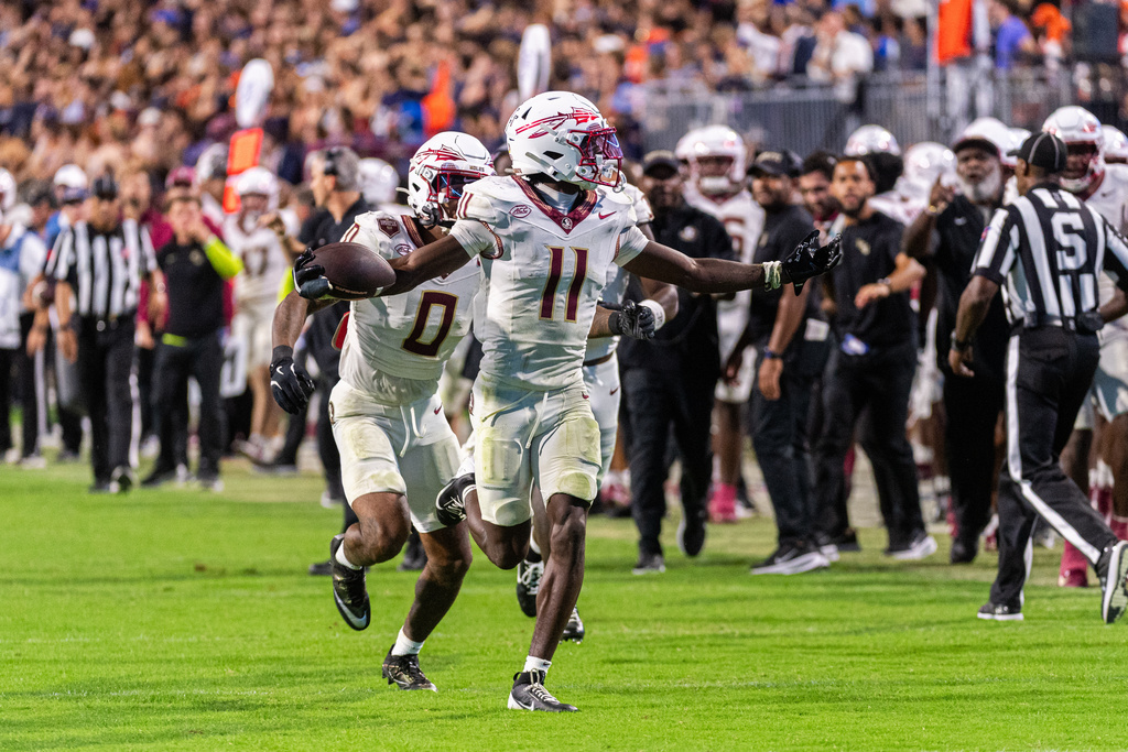 Florida State defensive back Ja'Bril Rawls (11) celebrates after interception against Virginia during the second half of an NCAA college football game, Friday, Sept. 26 2025, in Charlottesville, Va. (AP Photo/Robert Simmons)