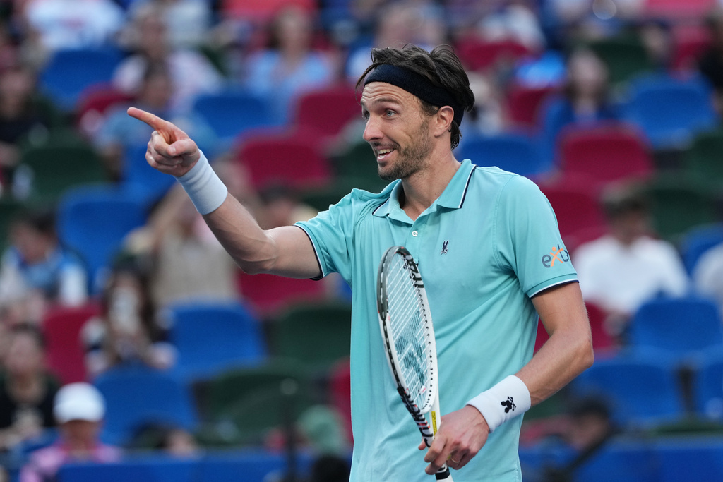Arthur Rinderknech of France reacts after defeating Felix Auger-Aliassime of Canada in their men's singles quarterfinal match of the Shanghai Masters tennis tournament at Qizhong Forest Sports City Tennis Center in Shanghai, China, Friday, Oct. 10, 2025. (AP Photo/Andy Wong)