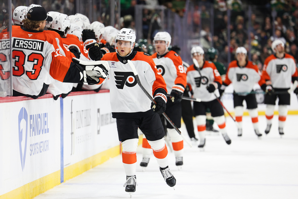 Philadelphia Flyers defenseman Emil Andrae (36) celebrates at the bench after scoring during the first period of an NHL hockey game against the Minnesota Wild Thursday, March 12, 2026, in St. Paul, Minn. (AP Photo/Ellen Schmidt)