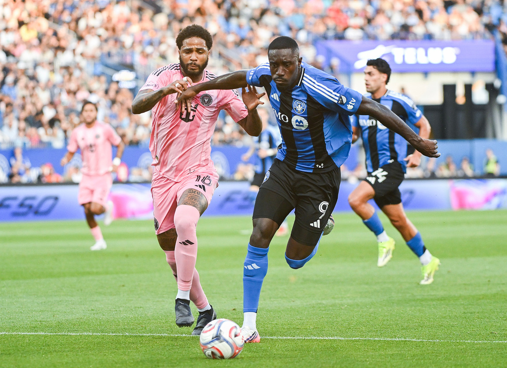 Inter Miami CF's Micael Dos Santos Silva (16) defends against CF Montreal's Prince Owusu (9) during first half MLS soccer action in Montreal, on Saturday, July 25, 2026. (Graham Hughes/The Canadian Press via AP)