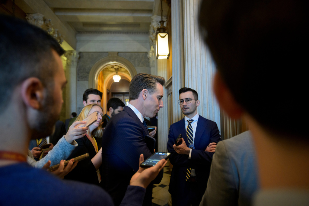 Sen. Josh Hawley, R-Mo., talks with reporters outside the Senate chamber during a vote at the Capitol, Tuesday, Jan. 6, 2026, in Washington. (AP Photo/Rod Lamkey, Jr.)