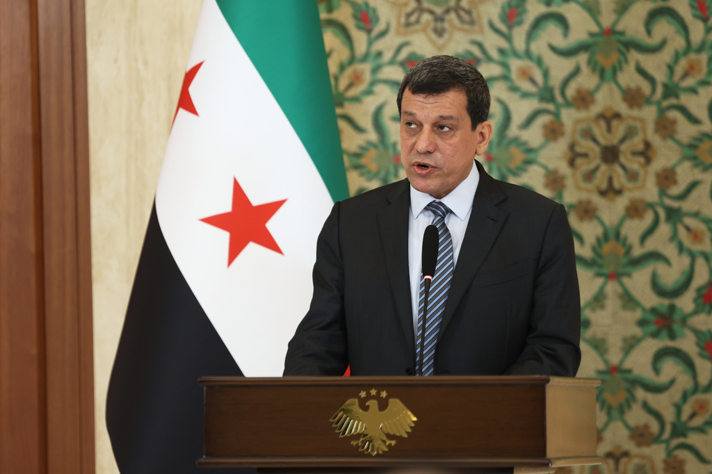 The commander of the Kurdish-led Syrian Democratic Forces Mazloum Abdi speaks during a news conference at the presidential palace in Damascus, Tuesday, Aug. 25, 2026. (AP Photo/Ghaith Alsayed)