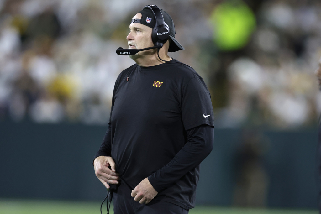 Washington Commanders head coach Dan Quinn watches from the sidelines during the second half of an NFL football game against the Green Bay Packers Thursday, Sept. 11, 2025, in Green Bay, Wis. (AP Photo/Matt Ludtke)