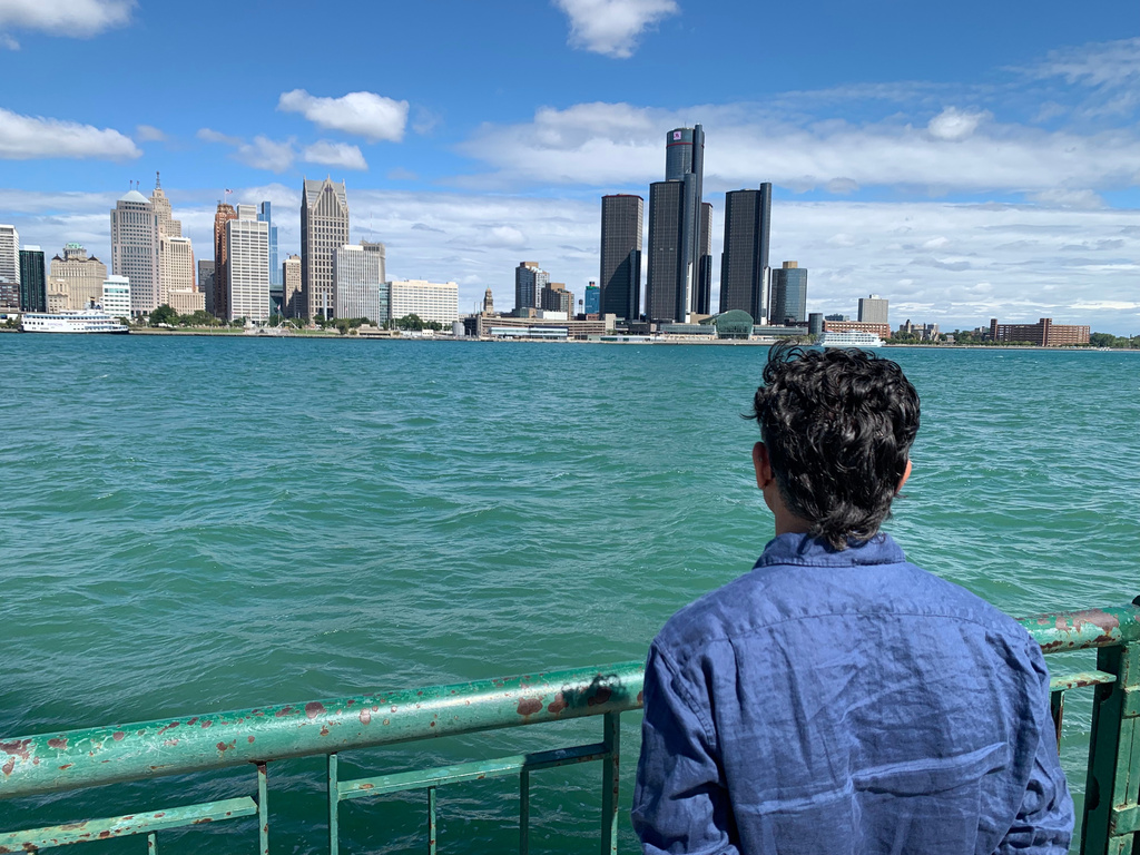 City Councillor Renaldo Agostino looks at the Detroit skyline across the Detroit River Monday, Aug. 24, 2026, in Windsor, Ontario (AP Photo/Mike Householder)