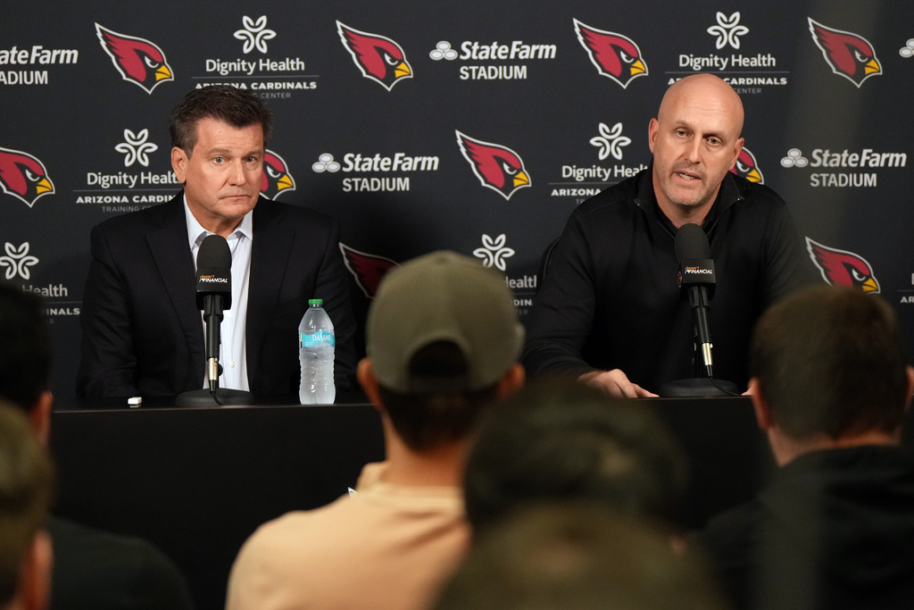 Arizona Cardinals owner Michael Bidwell and General Manager Monti Ossenfort acknowledge the media after firing head coach Jonathan Gannon Monday, Jan. 5, 2026, in Tempe, Ariz. (AP Photo/Rick Scuteri)