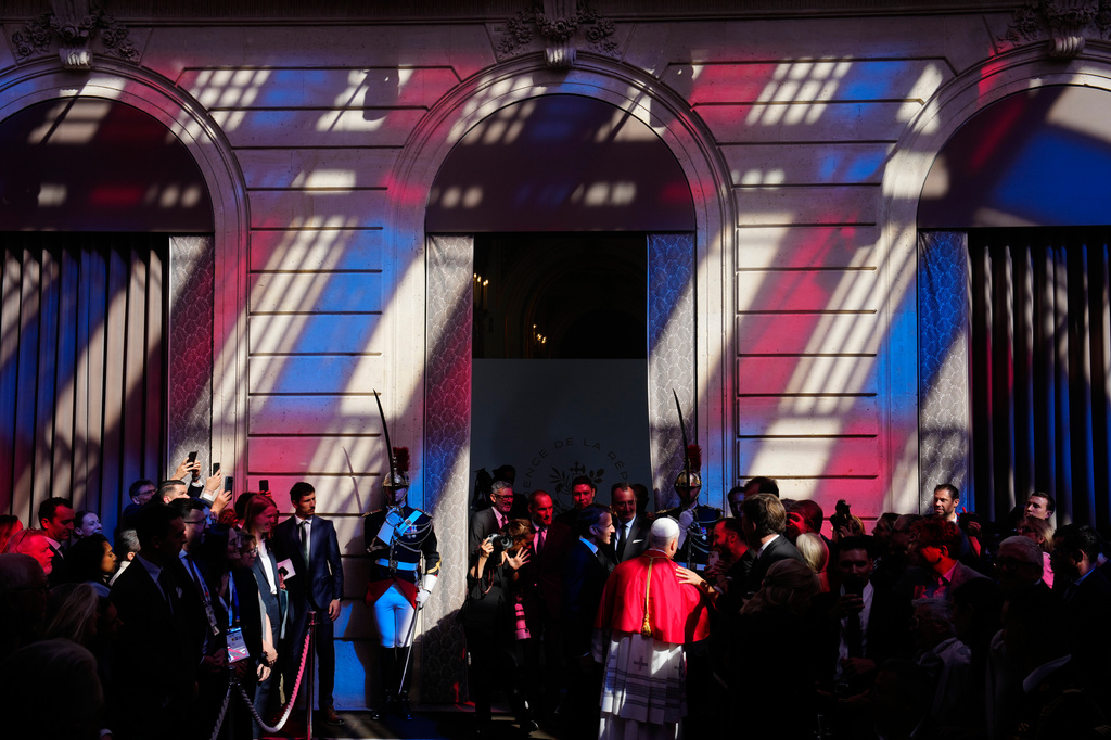 Pope Leo XIV, center right, and French President Emmanuel Macron, leave after a joint statement at the Elysee Palace, Friday, Sept. 25, 2026. (AP Photo/Teresa Suarez, Pool)