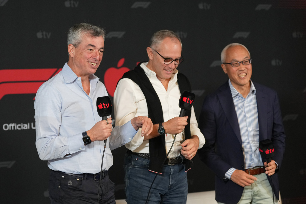 Apple's Eddy Cue, Senior Vice President of Services, left, F1 chairman Stefano Domenicali, center, and Derek Chang, CEO of Liberty Media, right, discuss a five-year partnership with Formula 1 and Apple TV to bring races to its streaming service beginning in 2026 during a news conference at the Circuit of the Americas in Austin, Texas, Friday, Oct. 17, 2025. (AP Photo/Eric Gay)