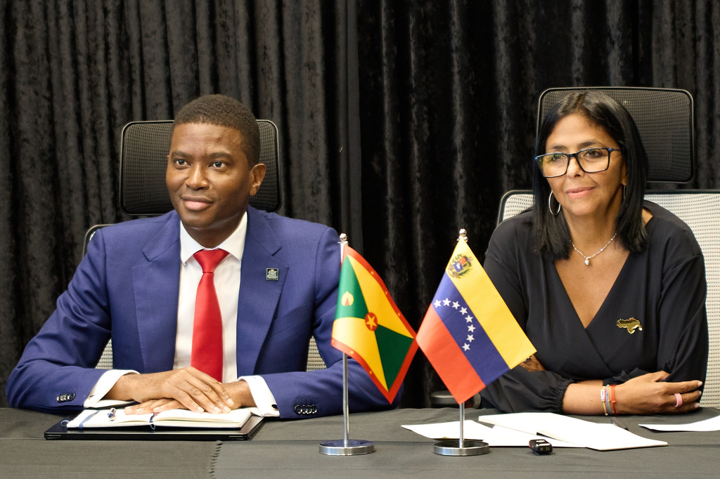 Grenada's Prime Minister Dickon Mitchell and Venezuela's acting President Delcy Rodriguez meet with the press at the Houses of Parliament in Saint George's, Grenada, Thursday, April 9, 2026. (AP Photo/Haron Forteau)