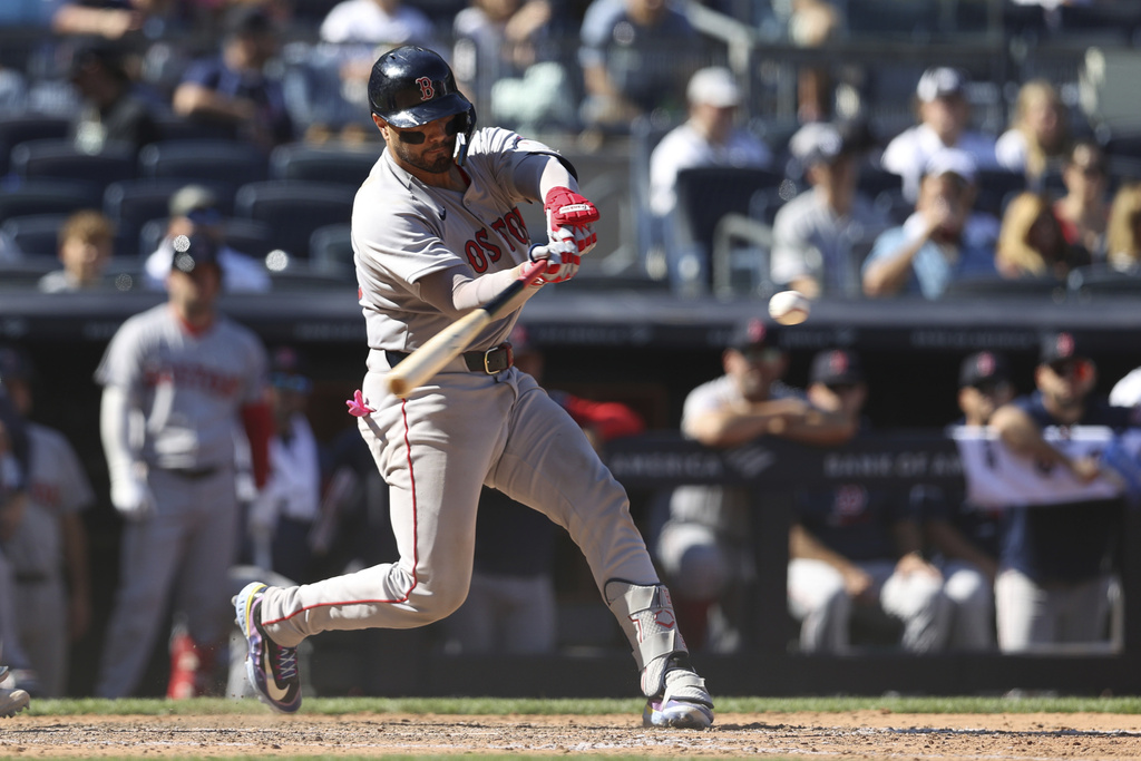 Boston Red Sox's Carlos Narváez hits a two-run home run leading David Hamilton to score during the ninth inning of a baseball game against the New York Yankees, Saturday, Aug. 23, 2025, in New York. (AP Photo/Pamela Smith)