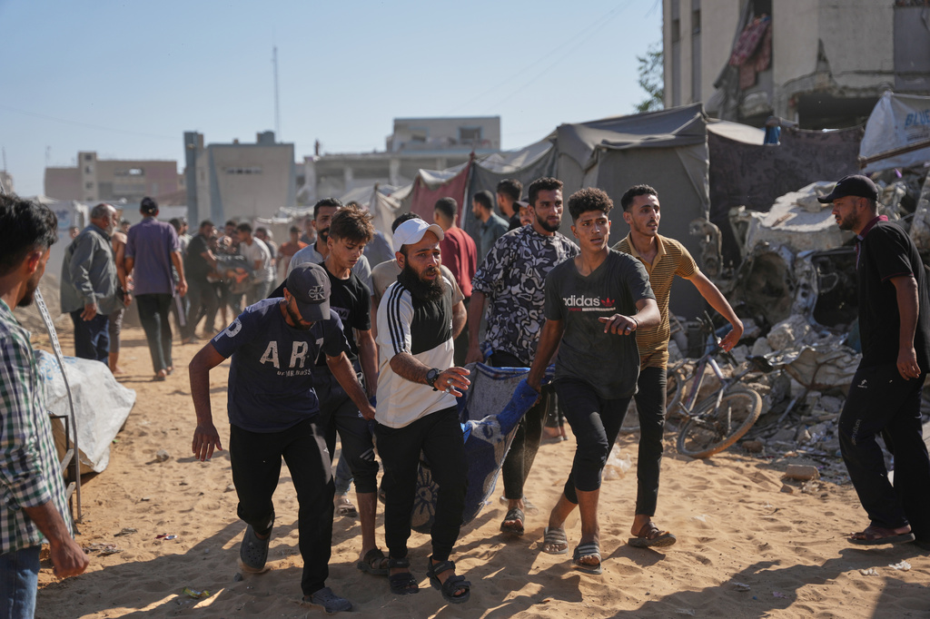 Residents evacuate a wounded man who was injured in an Israeli airstrike that targeted a tent housing Palestinians, in Gaza City, Saturday, June 6, 2026. (AP Photo/Abdel Kareem Hana)