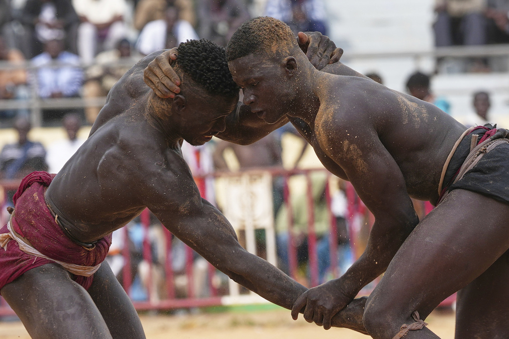 Wrestlers compete at the national wrestling arena in Dakar, Senegal, Sunday, April 5, 2026. (AP Photo/Misper Apawu)