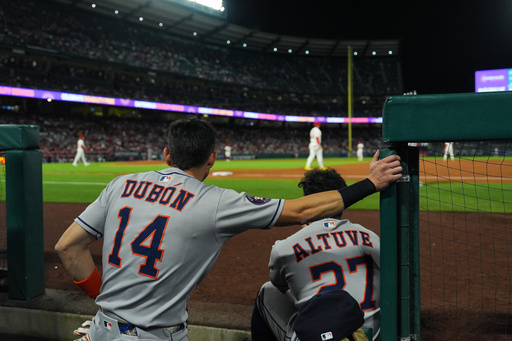 Houston Astros' Mauricio Dubon (14) and Jose Altuve (27) watch from the dugout during the third inning of a baseball game against the Los Angeles Angels Saturday, Sept. 27, 2025, in Anaheim, Calif. (AP Photo/Jae C. Hong) Houston Astros' Mauricio Dubon (14) and Jose Altuve (27) watch from the dugout during the third inning of a baseball game against the Los Angeles Angels Saturday, Sept. 27, 2025, in Anaheim, Calif. (AP Photo/Jae C. Hong)