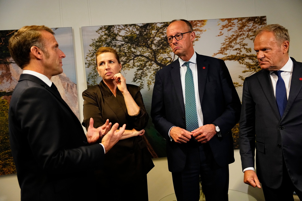 From left, France's President Emmanuel Macron, Danish Prime Minister Mette Frederiksen, German Chancellor Friedrich Merz and Poland's Prime Minister Donald Tusk talk during a meeting of the European Political Community (EPC) in Copenhagen, Denmark, Thursday, Oct. 2, 2025. (Mads Claus Rasmussen/Ritzau Scanpix via AP)