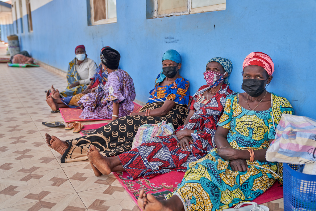 People in protective masks wait in the corridor of a hospital in Bunia, Congo, Tuesday, May 19, 2026. (AP Photo/Dirole Lotsima Dieudonne)