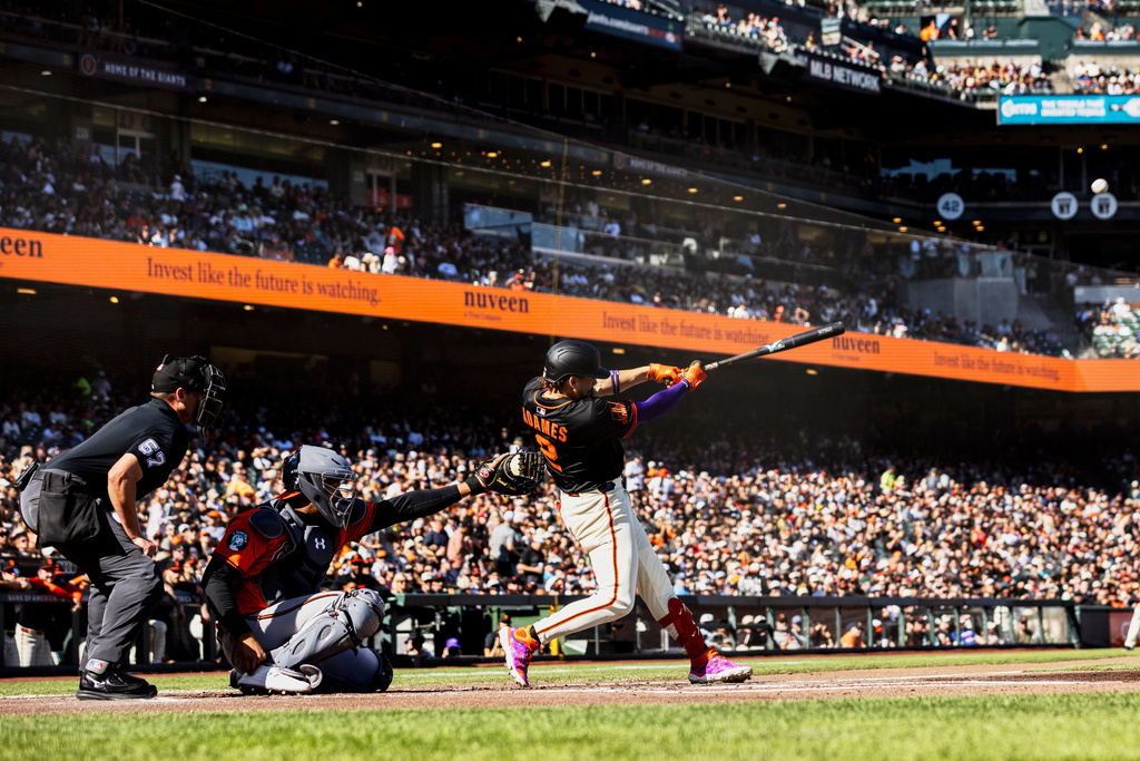 San Francisco Giants' Willy Adames (2) hits a solo home run during the first inning of a baseball game against the Baltimore Orioles in San Francisco, Saturday, Aug. 30, 2025. (Stephen Lam/San Francisco Chronicle via AP)