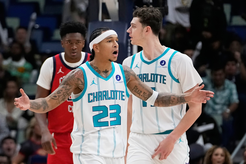 Charlotte Hornets guard Tre Mann (23) reacts after being called for a foul in the second half of an NBA basketball game against the New Orleans Pelicans, Tuesday, Nov. 4, 2025, in New Orleans. (AP Photo/Gerald Herbert)