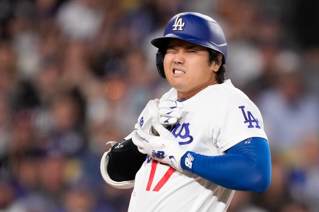 Los Angeles Dodgers' Shohei Ohtani reacts after being hit by a pitch during the fourth inning of a baseball game against the Colorado Rockies, Tuesday, May 26, 2026, in Los Angeles. (AP Photo/Mark J. Terrill)