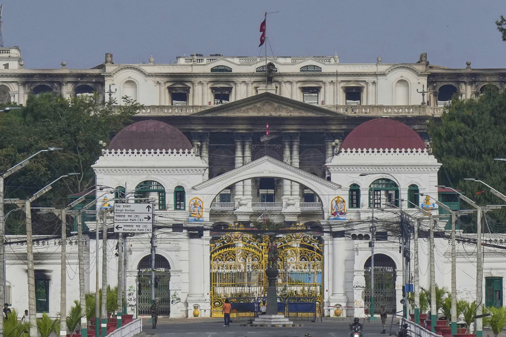 Singha Durbar, the seat of Nepal's government's various ministries and offices, is seen vandalized in Kathmandu, Nepal, Wednesday, Sept. 10, 2025. (AP Photo/Niranjan Shrestha)
