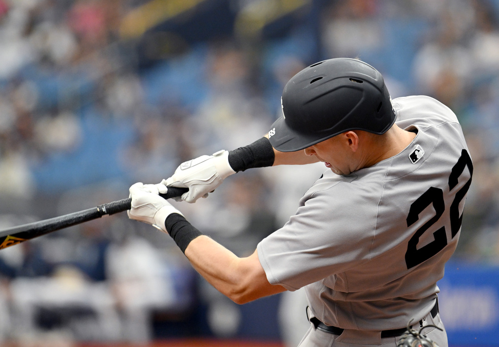 New York Yankees' Ben Rice hits a double during the seventh inning of a baseball game against the Tampa Bay Rays, Sunday, April 12, 2026, in St. Petersburg, Fla. (AP Photo/Jason Behnken)