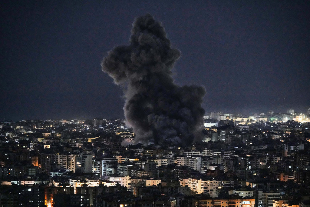Smoke rises from Israeli airstrikes in Dahiyeh, a southern suburb of Beirut, Lebanon, early Tuesday, March 3, 2026. (AP Photo/Bilal Hussein)