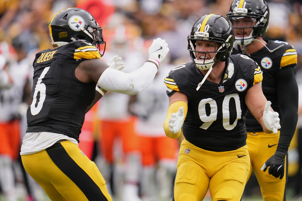 Pittsburgh Steelers outside linebacker T.J. Watt (90) celebrates with linebacker Patrick Queen (6) after a sack of Cleveland Browns quarterback Dillon Gabriel in the first half of an NFL football game in Pittsburgh, Sunday, Oct. 12, 2025. (AP Photo/Gene J. Puskar)