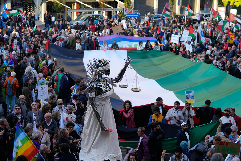 FILE -People protest against the participation of the Israeli national team in the 2026 Soccer World Cup qualification match against Italy being played in the evening in Udine, Italy, Oct. 14, 2025. (AP Photo/Luca Bruno, File)