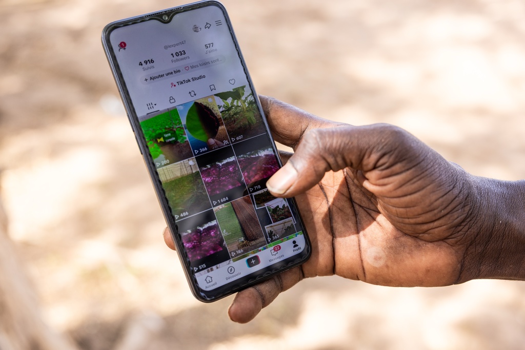 Pape Fall, a West African farmer who turned to Tiktok as part of agriculture's changing image, shows his account in Thies, Senegal, Thursday Dec. 11, 2025. (AP Photo/Caitlin Kelly)