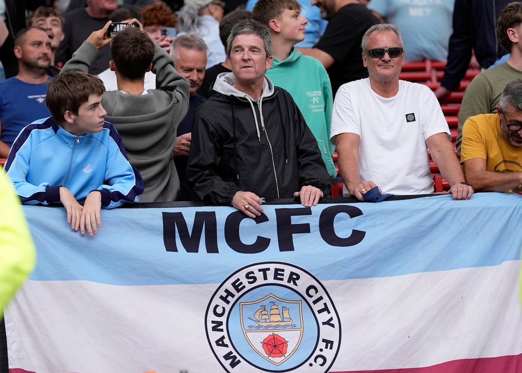 Manchester City supporter Noel Gallagher in the waits stands after the English Premier League soccer match against Manchester United in Manchester, England, Sunday Sept. 13, 2026. (Peter Byrne/PA via AP)