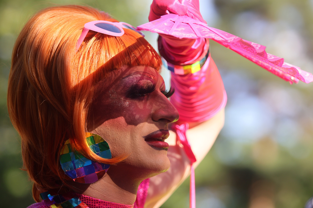 A participant shades her eyes during Pride Parade, in Sofia, Bulgaria, Saturday, June 13, 2026. (AP Photo/Valentina Petrova)